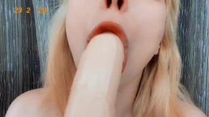 Sweetie Fox sucking dildo with pleasure 