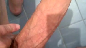 Cumming on blue tile floor