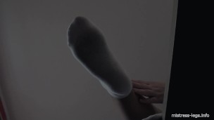 Legs in white socks on the table