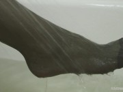 Black stockings in the bathroom and under the shower