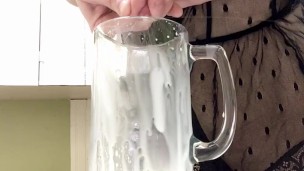 Sexy milf in lingerie squirting breastmilk into cup