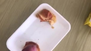 Adding the sauce to her breakfast 