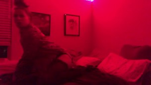 horny tgirl plays with herself in red light
