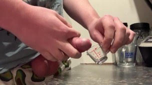 Cumming in a small measuring glass