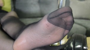 Feet is in black pantyhose after photoset. Soles close ups.