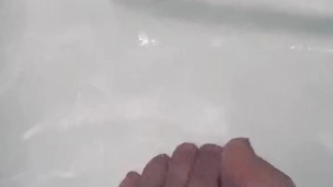 Wet toes in black bath 