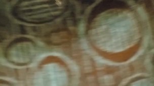 Morning spray on carpet and bed skirt, standing
