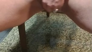 Hot MILF pissing in bowl