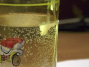 Russian cock cums in a glass and sperm blobs drowns in water; english text