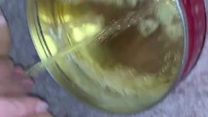 Small piss in empty cookie container 