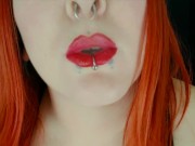 Smoking redhead with piercings and red lipstick Miss Vaga