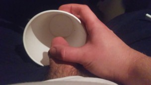 Pissing into a Mc Cup