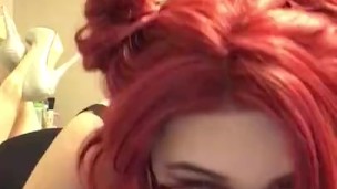 Redhead sucks a huge 12 inch dildo 