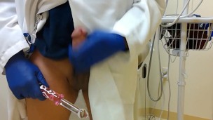 Doctor using Dildo in Exam Room Cums