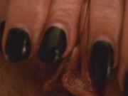 Woman masturbates pussy, clit closeup. Fingers slide on the clitoris.