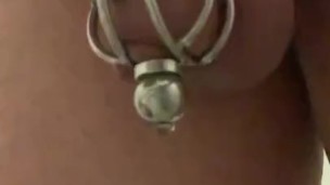 Caged sissy slave pee through urethral plug 