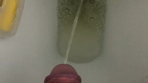 Peeing in the toilet.