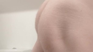 Caged brushing teeth and showing ass