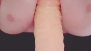  Big tits titty fucking a dildo