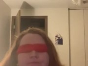 Gagging blindfolded on a dildo