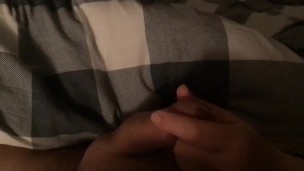 Casual handjob while wife watches tv on smartphone