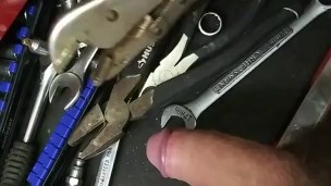 Mechanic plays with his tools