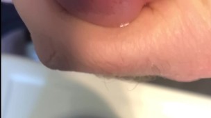 Oiled cock close up with orgasm