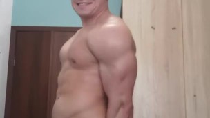 Muscle flex with hard cock