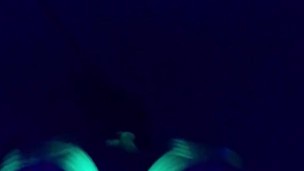 Glowing ebony ass under blacklight