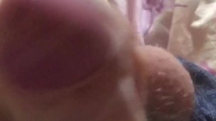 Jerked off a big cock roughly and finished with a big stream of sperm