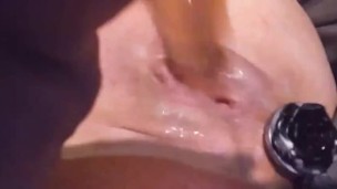 Slutty Milf with butt plug fucks creamy pussy