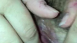 MILF plays with wet hairy pussy