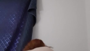 Redhead moaning loudly while masturbating 