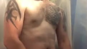 Muscular young man Stroking off in the shower