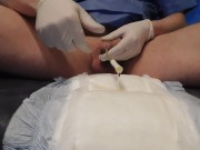 insert catheter (no foley) and pee on diaper
