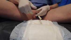 insert catheter (no foley) and pee on diaper