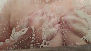 Rubbing my soapy tits in the shower 
