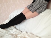 A schoolgirl in uniform shows her long legs 9/16