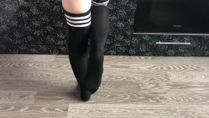 teen girl show her college knee high black socks