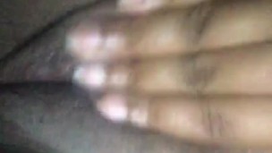 Jamaican girl plays with fat pussy