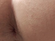 Rear view pissing in toilet