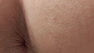 Rear view pissing in toilet