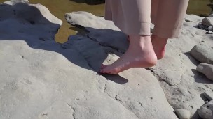  showing her feet on the river