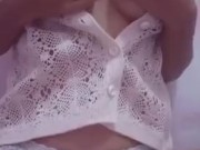Sexy little asian doll teasing her beautiful breasts