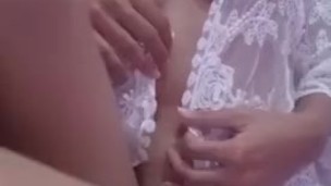 Sexy busty asian doll teasing her beautiful breasts