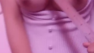 Asian teen smacking her tits with ruler hard