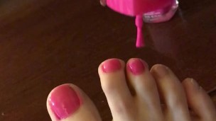 Teen paints toenails part 1