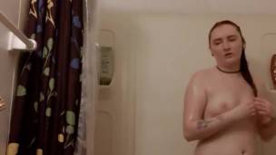 Sexy redhead showering 