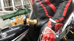 Leather biker milked on his motorcycle