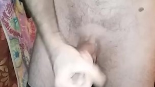 Pants pulled down stroking big dick using lotion and spit. Round three